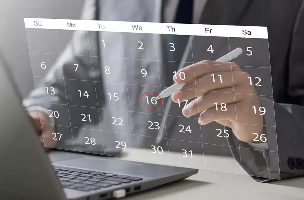 businessman using a laptop using a calendar on a virtual screen interface
